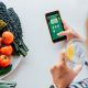 Woman loading app to track her water and calorie intake post-hysterectomy